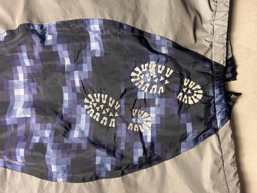 "GLITCHED" WINDBREAKER