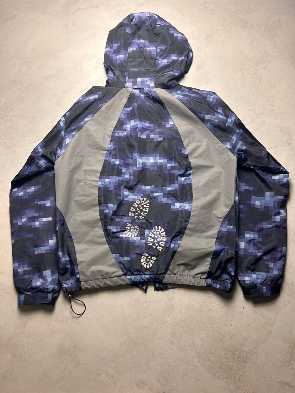 "GLITCHED" WINDBREAKER