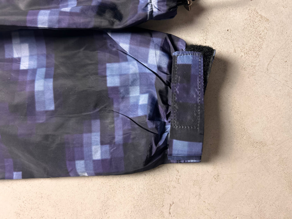 "GLITCHED" WINDBREAKER
