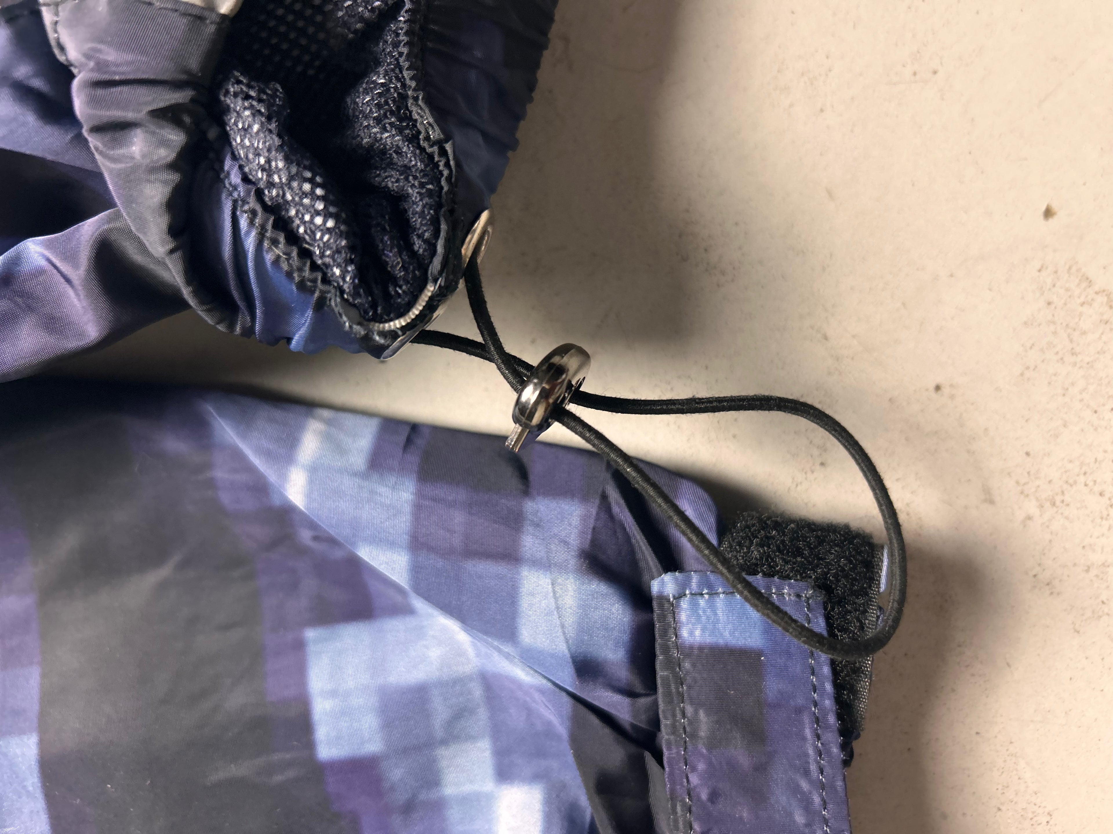 "GLITCHED" WINDBREAKER
