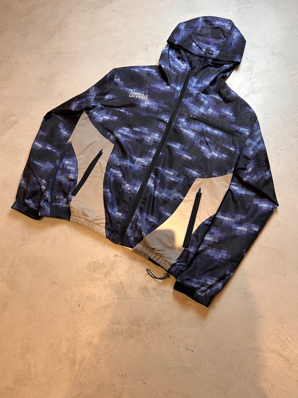 "GLITCHED" WINDBREAKER